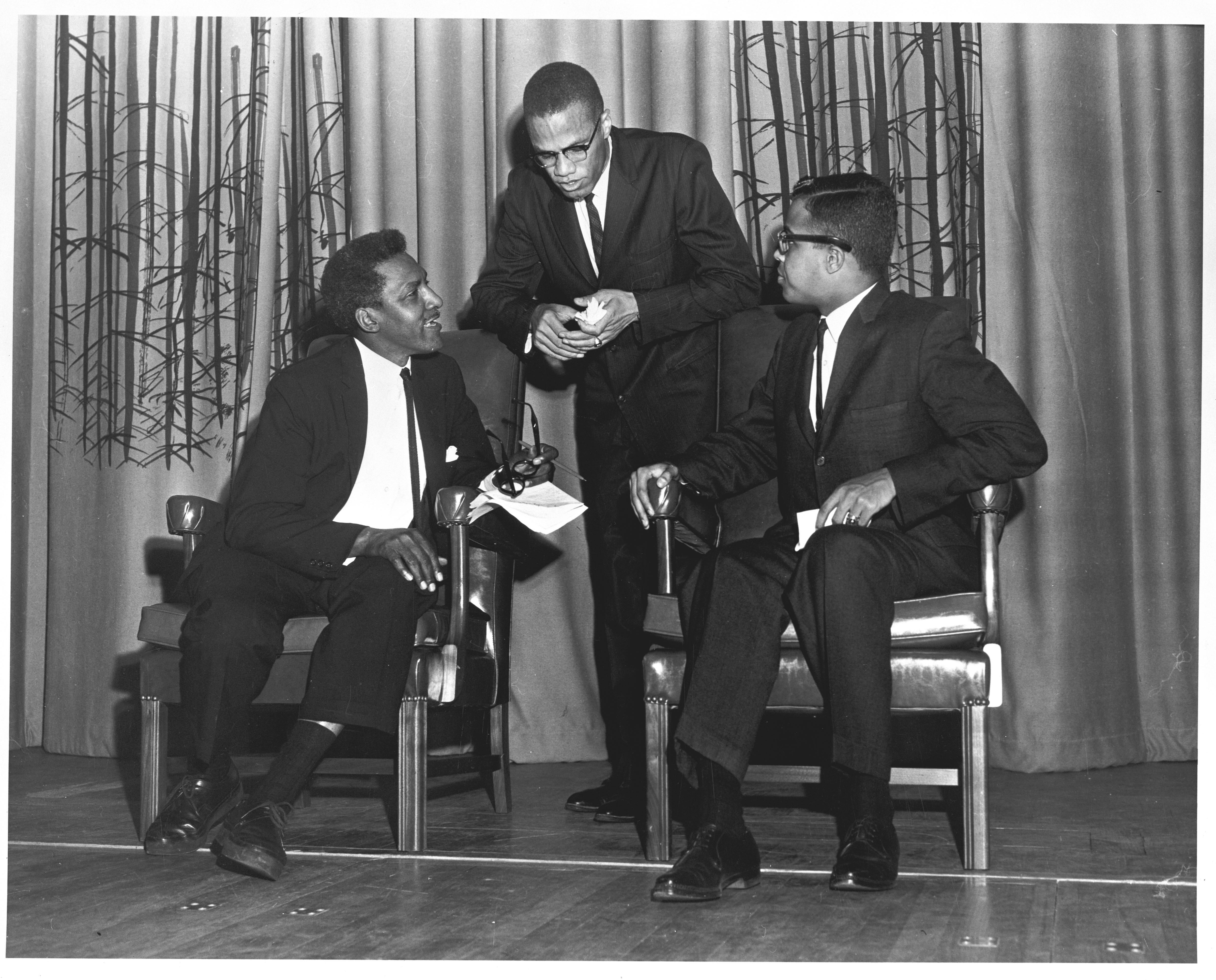 Malcolm X pictured with Bayard Rustin and Michael Winston in 1961