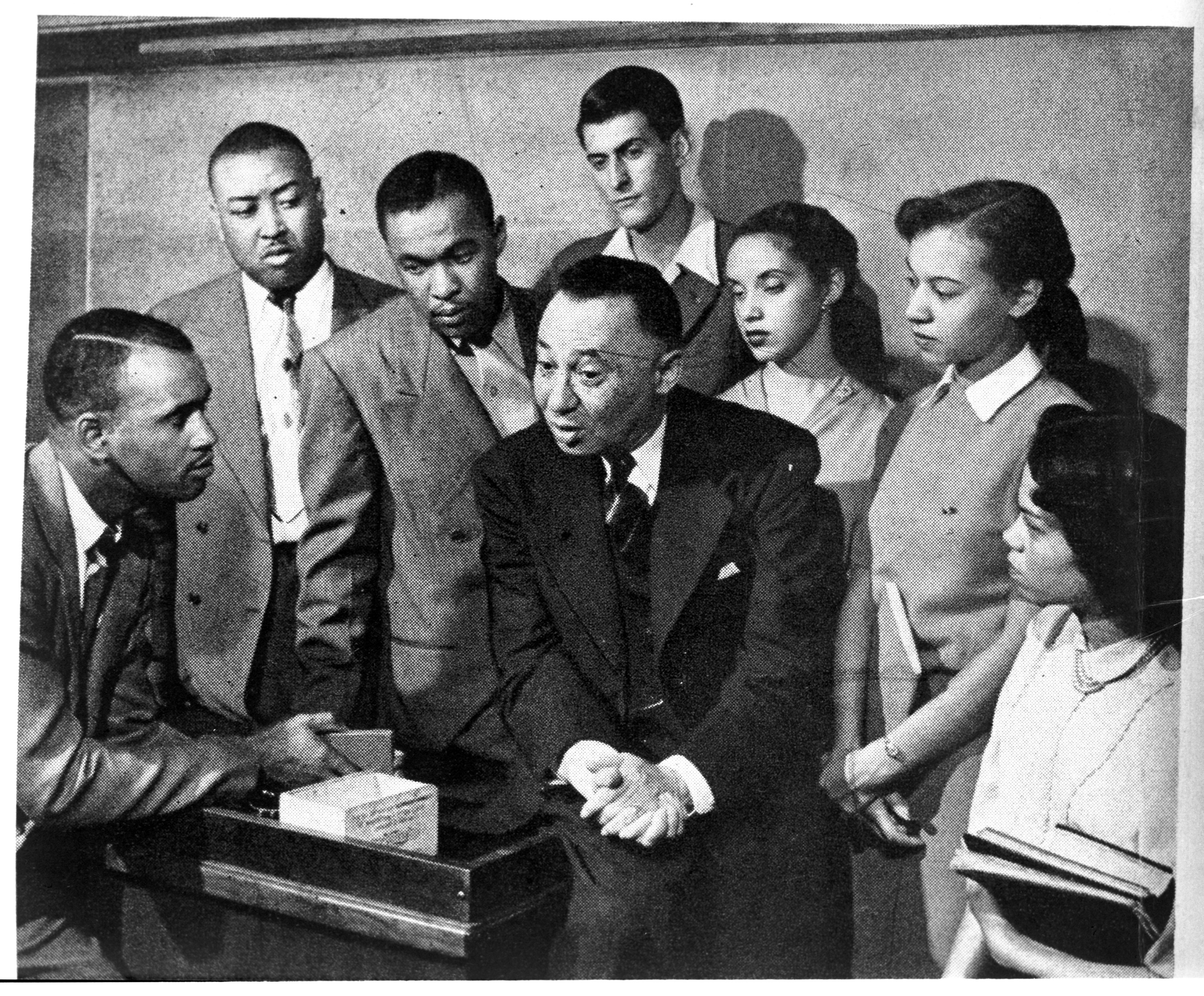 oward University historian and public intellectual, Rayford Logan (1897-1982) with his Howard students. 