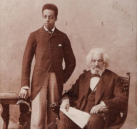 Photograph of Joseph Henry Douglass (standing) with his grandfather, Fredrick Douglass (seated)